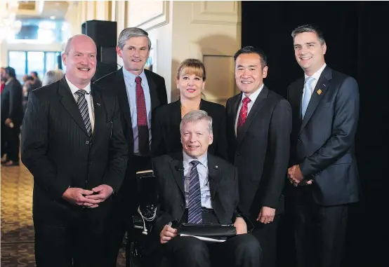  ?? — THE CANADIAN PRESS FILES ?? B.C. Liberal leadership candidates, from left, Mike de Jong, Andrew Wilkinson, Dianne Watts, Sam Sullivan, Michael Lee and Todd Stone pose for a photo before taking the stage for the first leadership debate in Surrey back in October.