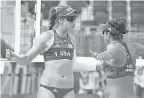  ?? JACK GRUBER/ USA TODAY SPORTS ?? Olympic beach volleyball players Kelly Claes ( 1) and Sarah Sponcil ( 2) on Monday.