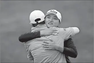  ?? LAURENT CIPRIANI/AP PHOTO ?? The tournament winner South Korea’s Ko Jin-Young, right, hugs South Korea’s Park Sung-Hyun on the 18th green during the last round of the Evian Championsh­ip on Sunday at Evian, eastern France.