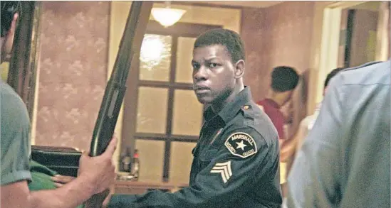  ?? Photograph­s by Annapurna ?? DISMUKES (JOHN BOYEGA) portrays a security guard who attempts to defuse the tense situation on both sides but ends up being abused and exploited instead.