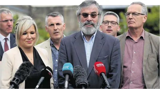  ??  ?? DEAL: Sinn Fein’s, from left, Mairtin O Muilleoir, Michelle O'Neill, Declan Kearney, Gerry Adams, Niall O Donnghaile and Gerry Kelly at Stormont Castle yesterday