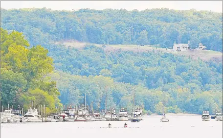  ?? Hearst Connecticu­t Media file photo ?? The Connecticu­t River in Portland. Town officials and owners of a riverfront property will split the cost of a plan to locate, excavate and clean an oil pipeline that has delayed the purchase of the 5.27-acre property since 2016.