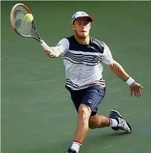  ??  ?? Inching his way through: Diego Schwartzma­n of Argentina returning a shot to Lucas Pouille of France in the fourth round on Sunday. — AP