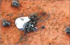  ?? PHOTOS BY JAXA VIA AP ?? A capsule, center, dropped by Hayabusa2 is seen before being retrieved Sunday in Woomera, southern Australia.