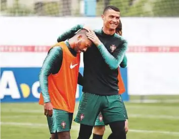  ?? Reuters ?? Portugal’s Cristiano Ronaldo and Manuel Fernandes in a lighter mood during training session in Kratovo yesterday.