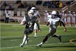  ?? Staff photo by Kelsi Brinkmeyer ?? ■ Pleasant Grove player Nathan Miers runs the ball down the field during their game against North Lamar on Friday. The Hawks won, 56-0.