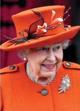  ??  ?? Tangerine dream: The Queen in her floral decorated hat
