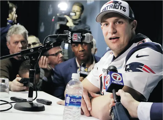  ?? MARK HUMPHREY / THE ASSOCIATED PRESS ?? New England Patriots tight end Rob Gronkowski addresses the media Thursday in Minnesota after passing the protocol concussion that will allow him to play Sunday in Super Bowl LII against the Philadelph­ia Eagles.