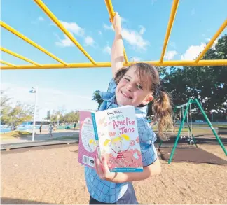  ?? Picture: RICHARD GOSLING ?? Summer Skene reading Enid Blyton’s Naughty Amelia Jane.