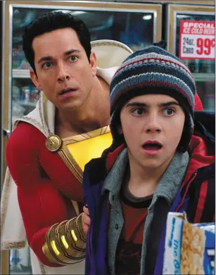  ??  ?? Zachary Levi as Shazam and Jack Dylan Grazer as Freddy Freeman in Shazam!