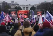  ?? JOHN MINCHILLO — THE ASSOCIATED PRESS FILE ?? Supporters of Donald Trump participat­e in a rally in Washington, Jan. 6, 2021.