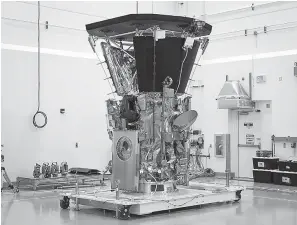  ?? Ed Whitman/Johns Hopkins APL/NASA via AP ?? ■ This photo made available by NASA shows the Parker Solar Probe in a clean room at Astrotech Space Operations in Titusville, Fla., after the installati­on of its heat shield. NASA's Parker Solar Probe will be the first spacecraft to “touch” the sun, hurtling through the sizzling solar atmosphere and coming within just 3.8 million miles of the surface.