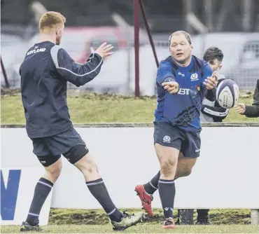  ??  ?? WP Nel, right, looked in fine fettle during Scotland’s open training session at Netherdale yesterday.