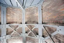  ??  ?? The 100-year-old brick lining the interior of the legislatur­e cupola will be replaced with spray-on concrete.