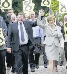  ??  ?? HIGH HOPES McDonald celebrates his election victory with Nicola Sturgeon in 2013. Below, with Alex Salmond at the Scottish Parliament and our story on his Twitter pic