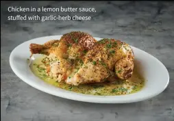  ??  ?? Chicken in a lemon butter sauce, stuffed with garlic-herb cheese