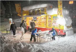  ?? THE NEW YORK TIMES ?? A snow-covered food truck at the Niseko ski resort area on Hokkaido, in Kutchan, Japan.