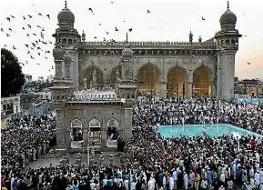  ?? AP ?? People pray during the funeral of the last titular Nizam of Hyderabad, Mukarram Jah, in Hyderabad on Wednesday. Jah, who died in Turkey on January 14, was buried with full state honours in the family’s vault in the forecourt of the city’s Mecca Masjid where the Nizam’s family who ruled Hyderabad from 1724 are buried.