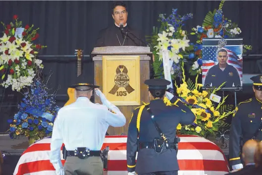  ?? ADOLPHE PIERRE-LOUIS/JOURNAL ?? Bishop Oscar Cantú of the Diocese of Las Cruces eulogizes Hatch police officer Jose Chavez during his funeral Sunday afternoon at the Pan American Center in Las Cruces.