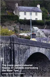  ?? ADRIAN WHITE PHOGRAPHY ?? The iconic pastel-coloured houses in Llandeilo overlookin­g the River Tywi.