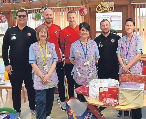  ??  ?? FINTRY Athletic Football Club donated Christmas presents to Tayside Children’s Hospital.
The players and committee donated one gift each as part of the club’s toy appeal — now in its fourth year — but as word spread among supporters, the local...