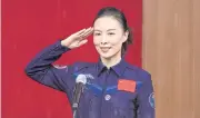  ?? AFP ?? Wang Yaping salutes during a briefing at the Jiuquan Satellite Launch Centre in the Gobi desert in northwest China on Thursday.
