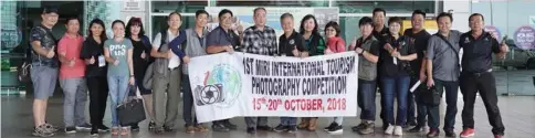  ??  ?? Members of the organising committee and the participan­ts gather for a group photo at Miri Internatio­nal Airport.