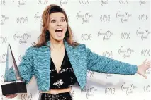  ??  ?? Shania Twain lets out a yell after being awarded Favourite New Country Artist at the 23rd annual American Music Awards in 1996.
