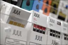  ?? SETH WENIG / ASSOCIATED PRESS 2018 ?? Philip Morris and Altria have ended merger talks and Juul’s CEO is stepping down from the top post as criticism over vaping continues to intensify.