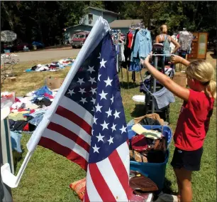  ?? FILE PHOTO/KAREN E. SEGRAVE ?? “I love Bargains Galore on 64 because all of the sales are on the highway,” says profession­al dealer Shara Stacks. “No turning off the road or looking for addresses. It’s all very organized.”