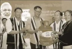  ?? PTI ?? Union minister of state for home affairs Kiren Rijiju and chief minister of Arunachal Pradesh Pema Khandu during launch of Pradhan Mantri Ujjwala Yojana, Itanagar, 2017