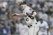  ?? Mike Nelson EPA-EFE/REX/Shuttersto­ck ?? CHRIS DEVENSKI celebrates after beating the Dodgers in Game 2 of the World Series.