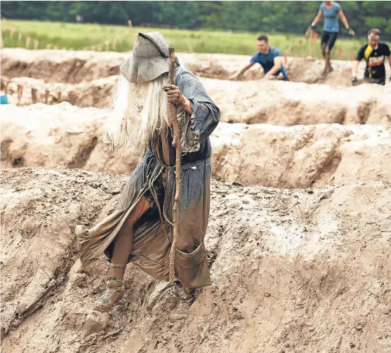  ?? Picture: PA. ?? Participan­ts take part in a Tough Mudder event race at Drumlanrig Castle, Thornhill.