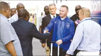 ??  ?? STAR ATTRACTION . . . New Everton striker Wayne Rooney shakes the hands of a SportPesa ambassador having arrived at the team hotel in Dar es Salaam, Tanzania, yesterday ahead of today’s friendly match against Kenyan giants Gor Mahia