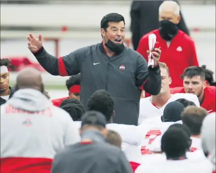  ?? JAY LAPRETE PHOTOS — THE ASSOCIATED PRESS ?? Ohio State head coach Ryan Day talks to his team during practice Oct. 3. The Buckeyes are favored towin a fourth straight Big Ten title.