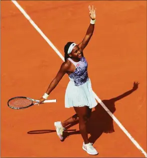  ?? Adam Pretty / Getty Images ?? Coco Gauff celebrates after winning match point against Sloane Stephens during their quarterfin­al match at the French Open on Tuesday.