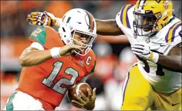  ?? RONALD MARTINEZ/ GETTY IMAGES ?? Miami quarterbac­k Malik Rosier was off-target much of the game Sunday, completing just 15 of his 35 passes with two intercepti­ons against LSU.