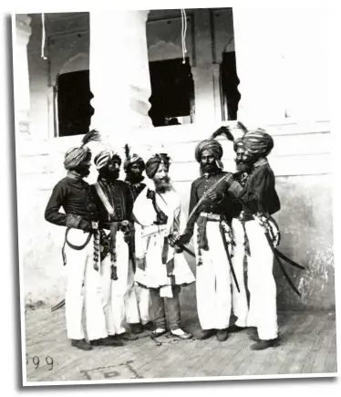  ??  ?? Above: Alexander Gardner, inspecting a sword with Dogra troops in Kashmir, 1864, always wore the local garb. Right: A pastel on paper drawing of Alexander Gardner in a tartan turban, by George Landseer, c 1865–69.