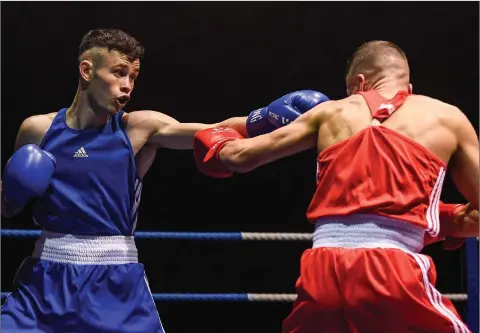  ??  ?? Enniskerry Boxing Club’s Sean Purcell in action against Conor Kerr of Monkstown.