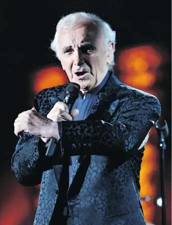  ?? BILAL HUSSEIN/THE ASSOCIATED PRESS ?? Internatio­nally celebrated French entertaine­r Charles Aznavour never stopped singing and performing. He was even planning an upcoming tour in his 90s.