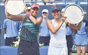  ?? Catherine Avalone / Hearst Connecticu­t Media ?? Andrea Sestini Hvalackova and Barbora Strycova celebrate their win over Su-Wei Hsieh and Laura Siegemund in the doubles championsh­ip at the Connecticu­t Open.