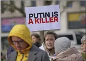  ?? YUI MOK — PA VIA THE ASSOCIATED PRESS ?? People gather in London's Hyde Park on Sunday ahead of a march to the Russian Embassy. The march, organized by the Russian Democratic Society, marked the two-year anniversar­y of the Russian invasion of Ukraine.