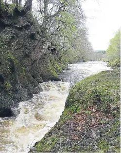  ?? Picture: Angus Whitson. ?? The River North Esk in spate at The Loups, completely engulfing the fish pass.