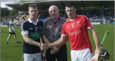  ??  ?? Bray captain Marc Lennon, referee Ciaran Fleming and Glenealy captain Gary Byrne before the start of the Senior hurling final in Aughrim.