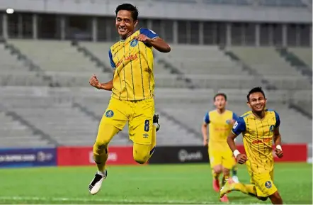  ??  ?? Sheer delight: Pahang’s Nik Muhd Sharif Haseefy Mohd Lazim celebrates after scoring against Kedah at the Darul Makmur Stadium. — Bernama