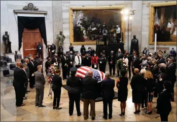  ?? The Associated Press ?? FAREWELL: Members of the Congressio­nal Black Caucus, say farewell at the conclusion of a service for the late Rep. John Lewis, D-Ga., a key figure in the civil rights movement and a 17-term congressma­n from Georgia, as he lies in state at the Capitol in Washington, Monday.