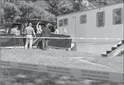  ?? Arkansas Democrat- Gazette/ BENJAMIN KRAIN ?? Little Rock police investigat­e a double homicide Monday morning after two women were found dead inside a vehicle parked next to a vacant mobile home at 11500 Chicot Road.