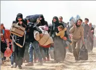  ?? OMAR SANADIKI / REUTERS ?? Civilians flee war-torn eastern Ghouta, Syria, on Thursday.