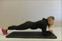  ?? Rebecca Droke/Post-Gazette ?? The plank position helps strengthen the core muscles.