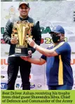  ??  ?? Best Driver Ashan receiving his trophy from chief guest Shavendra Silva, Chief of Defence and Commander of the Army